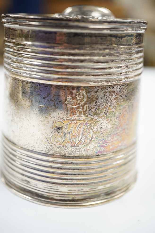 A George V repousse silver dressing table tray, William Neale Ltd, Birmingham, 1910, 29.1cm, two silver cigarette cases, a George III silver christening mug (a.f.) and four silver mounted glass toilet jars. Condition - p